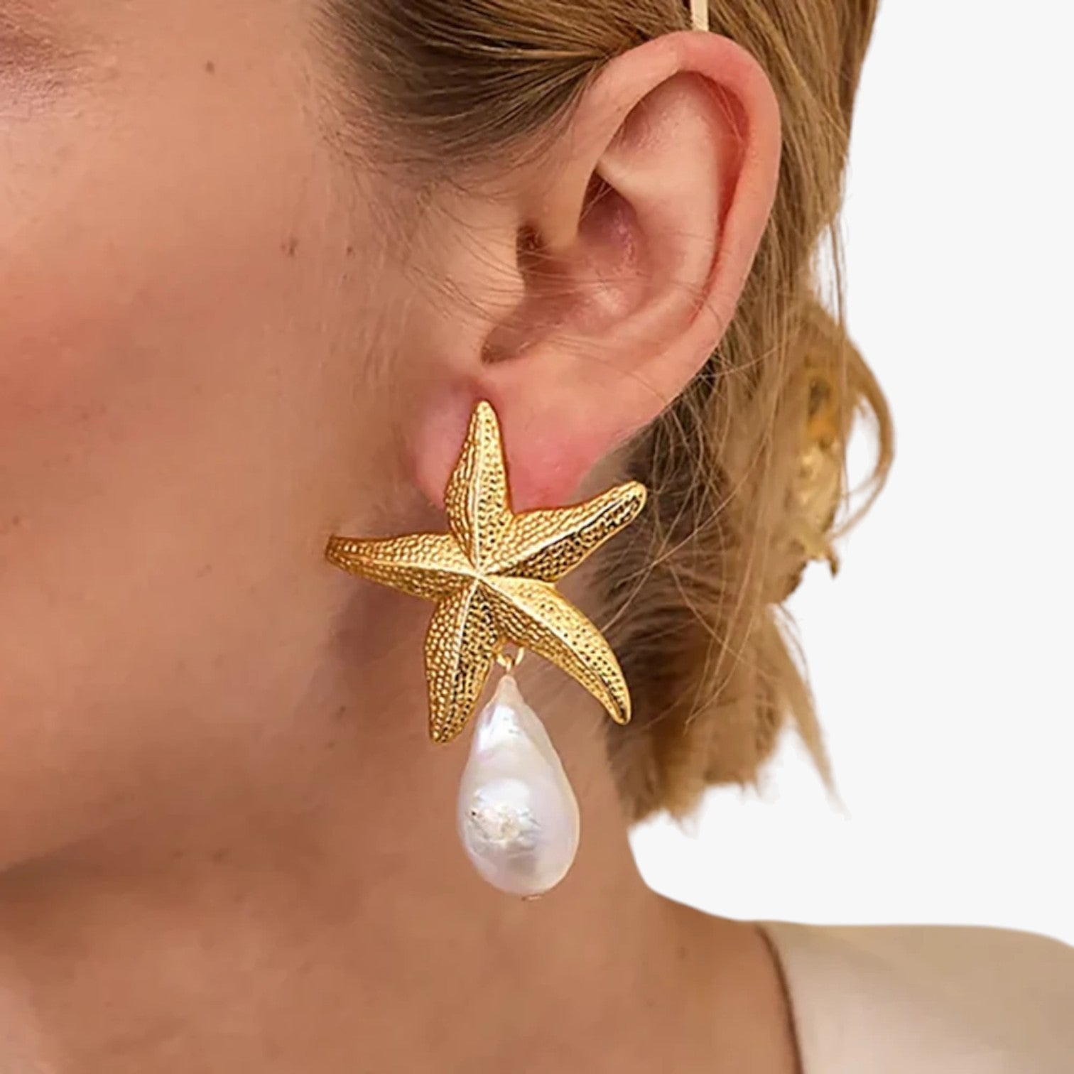 Xyla | Stilfulde skjellformede øreringe til en sommerlig stemning - - Xyla | Stilfulde skjellformede øreringe til en sommerlig stemning - €25 - {{ product_tags }