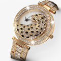 Heidi | Orologio al quarzo dorato con glitter e motivo leopardato